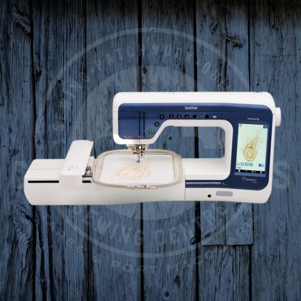 White embroidery machine with blue faceplate, stitching a gold design